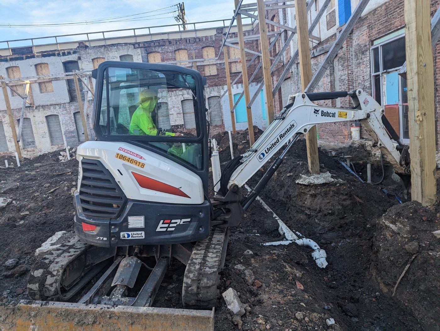 GPIS crew operating an excavator on a new construction site